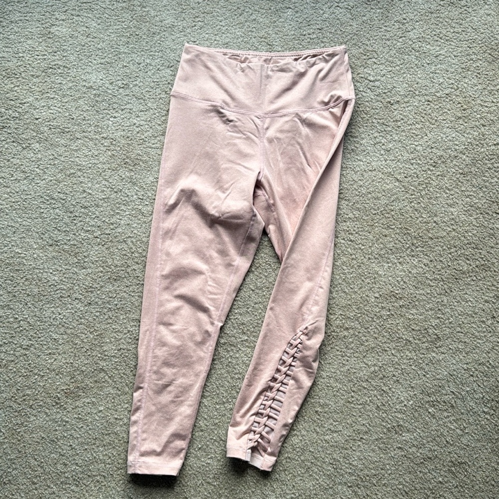 Long, Soft, stretchy, pink leggings. Size large. Color light pink.